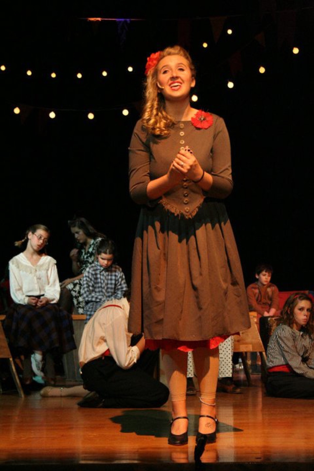 Taylor Fox in a featured role in Godspell, on stage in costume
